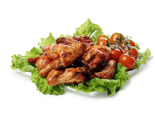 A plate of chicken wings with tomatoes and lettuce, a delicious and appetizing dish.